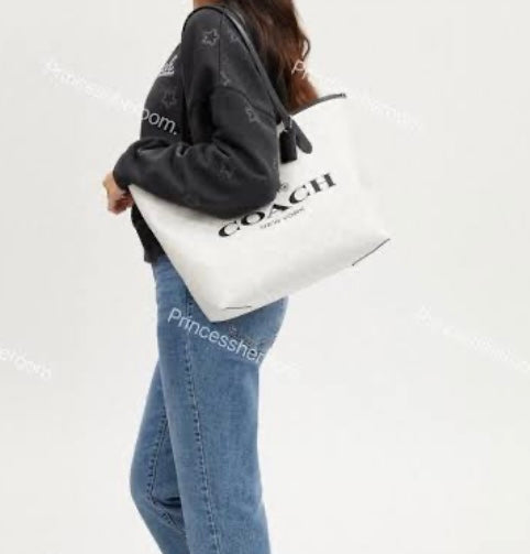 Bolsa duo  Tote Coac/h para dama M2576 con pochette imagen de referencia incluye caja y cubre p贸lvora y